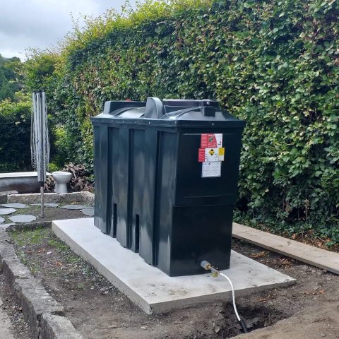 plastic bunded oil tank on a concrete base